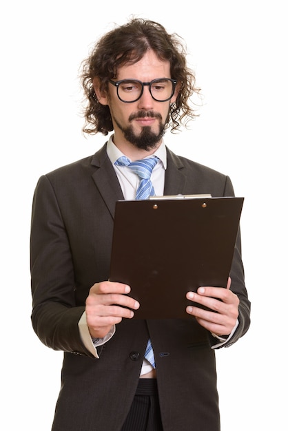 Handsome Caucasian businessman reading clipboard isolated