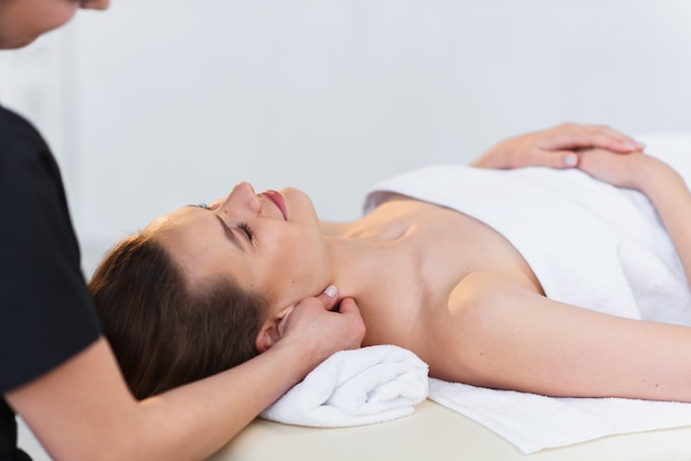 Handsome caucasian woman during spa treatment in the spa salon.