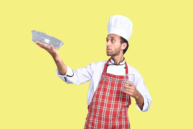 handsome chef cook holding bowl and glass indian pakistani model