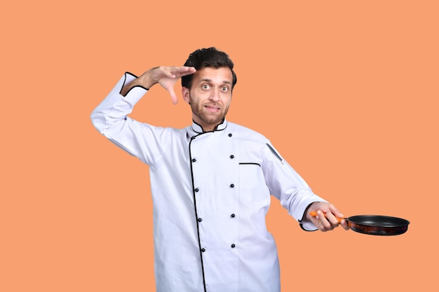 handsome chef cook white outfit holding fry pan indian pakistani model