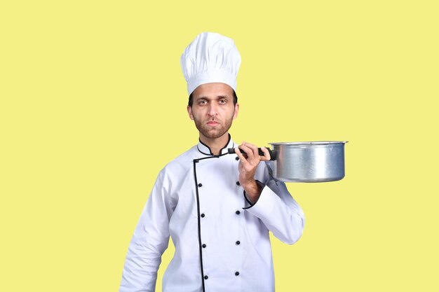 handsome chef cook white outfit holding pan indian pakistani model