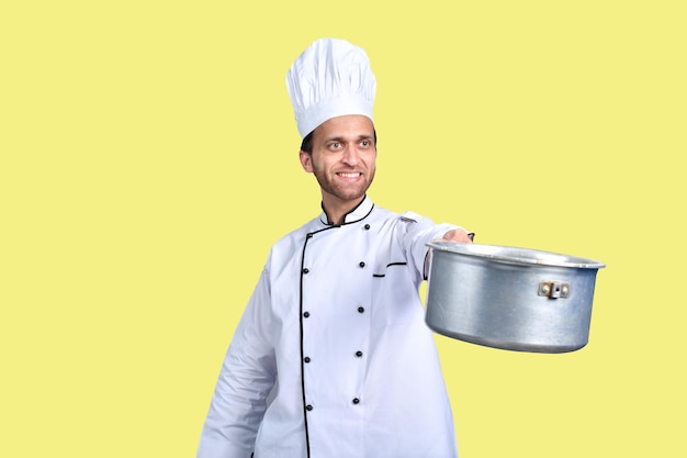 handsome chef cook white outfit holding pan indian pakistani model