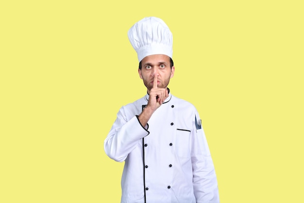 handsome chef cook white outfit over yellow background indian pakistani model