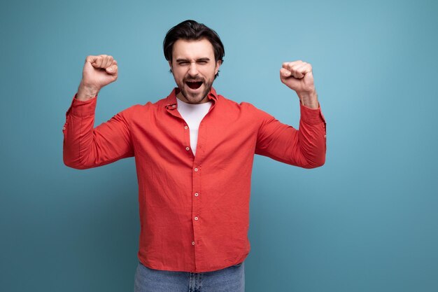 Handsome confident dark haired s man in red shirt