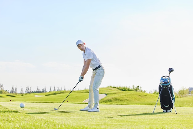 Handsome confident male golfer