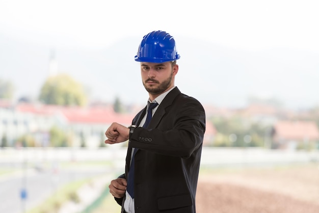 Handsome Construction Manager Looking At His Watch