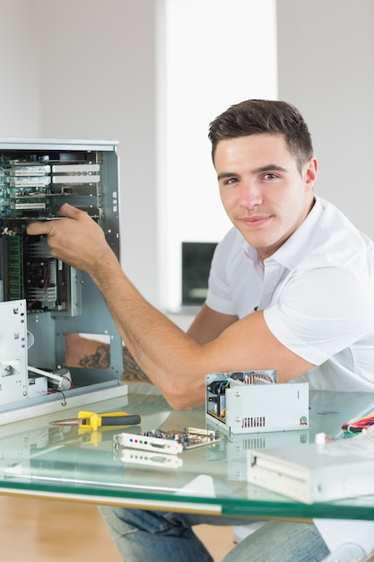 Handsome content computer engineer working at open computer