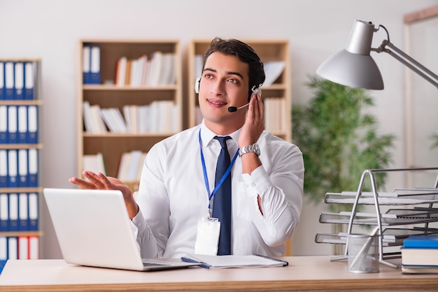 Handsome customer service clerk with headset 