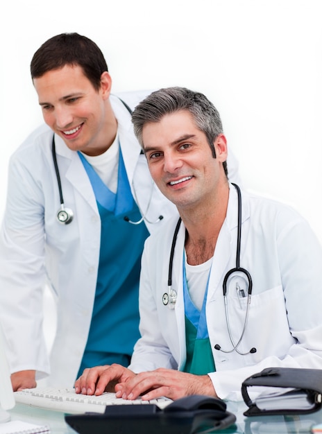 Handsome doctors working at computer