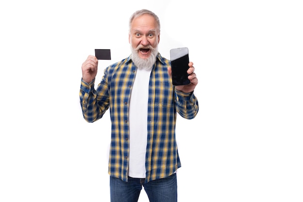 Handsome elderly grayhaired retired man with mustache and beard with card and phone mockup