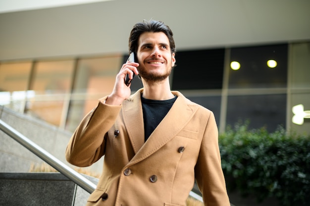 Handsome elegant dressed man talking on the phone