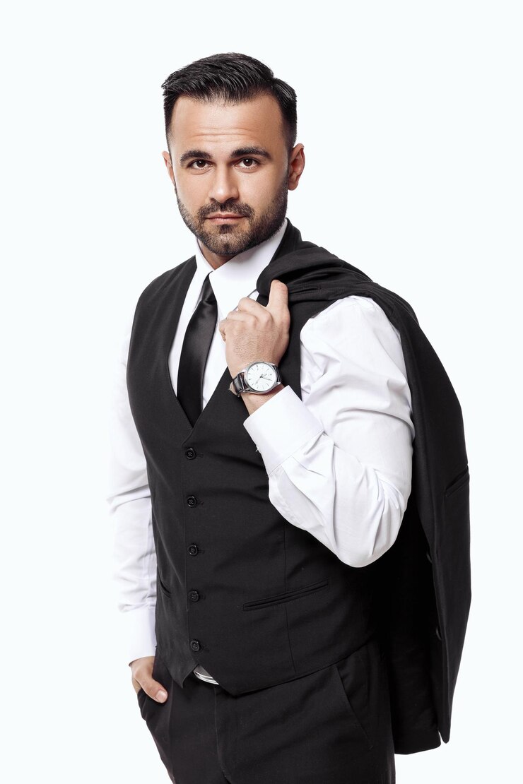 Handsome elegant sexy man in black suit on white background. businessman