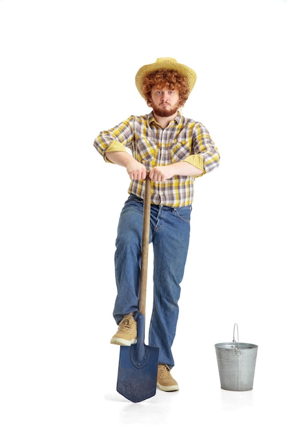 Handsome farmer rancher isolated over white studio background