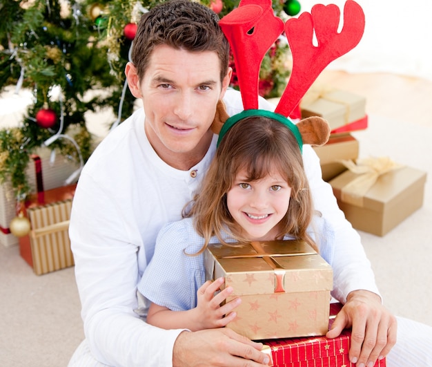 Handsome father celebrating christmas with his daughter