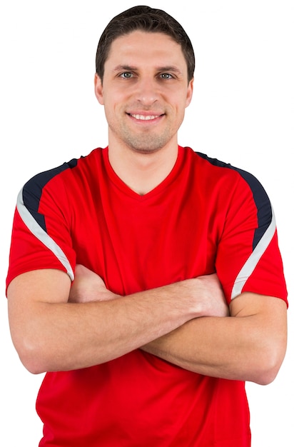 Handsome football player looking at camera