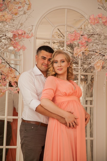 Handsome future parents in beige interior