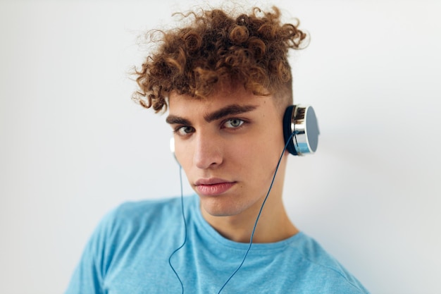 Handsome guy in blue tshirts headphones fashion Lifestyle unaltered