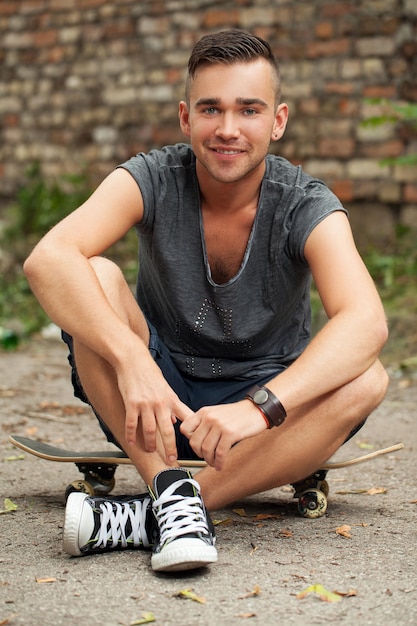 Handsome guy sitting in the street