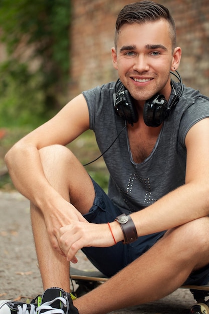 Handsome guy sitting in the street