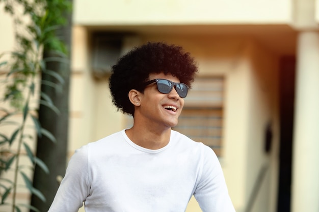 Handsome guy with afro hairstyle and sunglasses