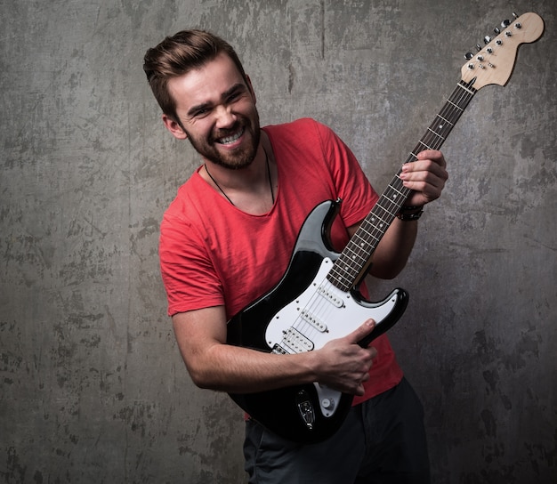 Handsome guy with electric guitar