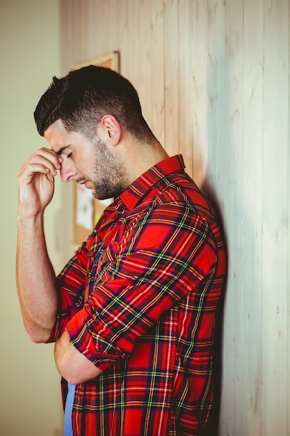 Handsome hipster feeling stressed out