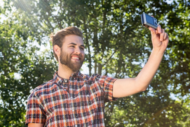 Handsome hipster taking a selfie