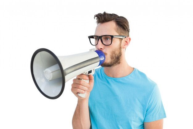 Handsome hipster talking through megaphone