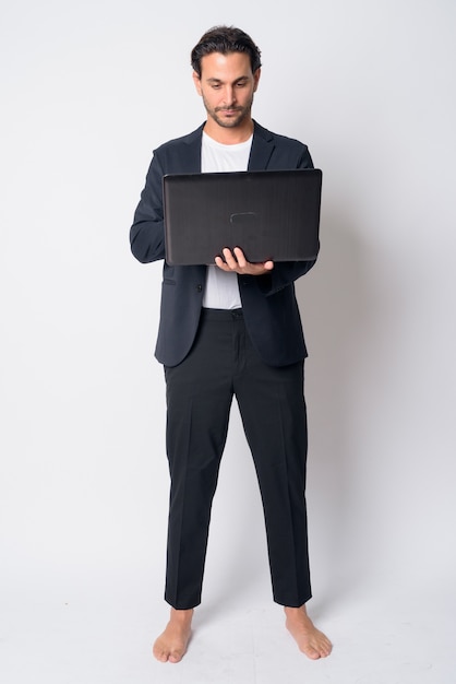 handsome Hispanic businessman wearing suit