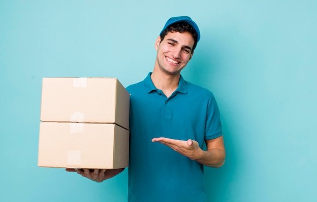 Handsome hispanic man smiling cheerfully feeling happy and showing a concept employee concept