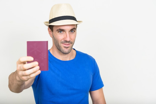 handsome Hispanic tourist man ready for vacation on white