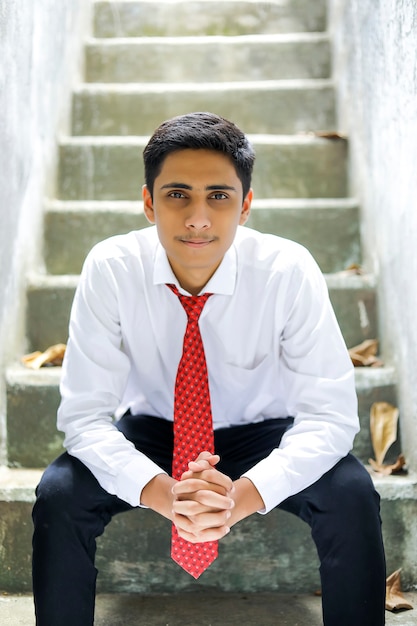 Premium Photo  Handsome indian young boy wearing white shirt and red tie