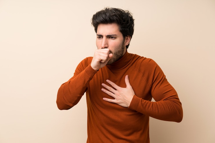 Photo handsome over isolated wall is suffering with cough and feeling bad