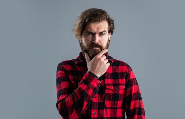 Handsome macho brutal caucasian hipster with moustache Male barber care serious bearded man Hair and beard care Confident and handsome brutal man Facial care Mature hipster with beard