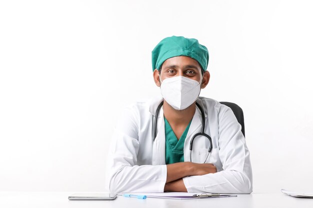 Handsome male doctor on white background