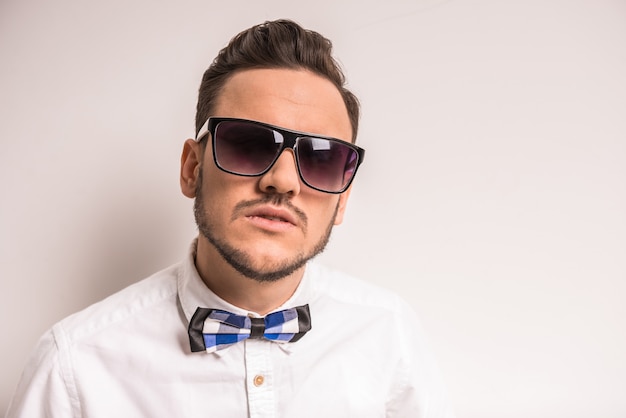 Handsome male in glasses and bow tie