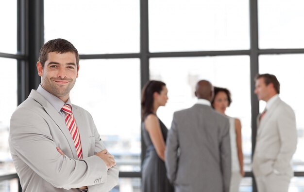 Handsome male manager leading his team