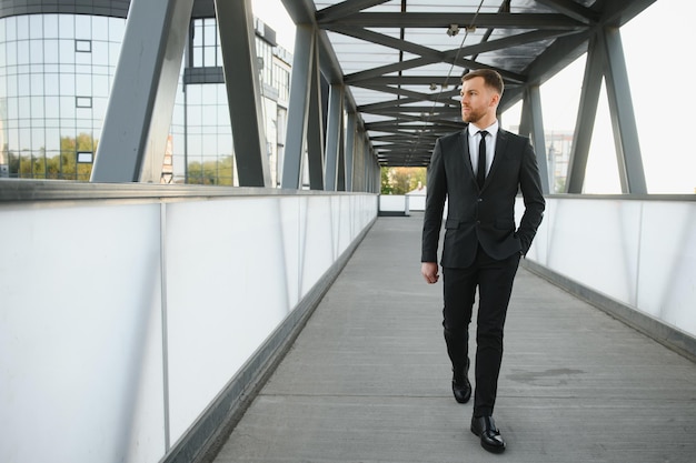 Handsome male model posing wearing a back suit