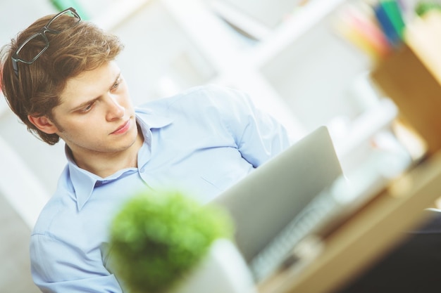 Handsome male using laptop