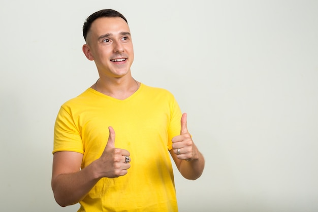  handsome man against white wall