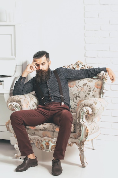 Handsome man in armchair