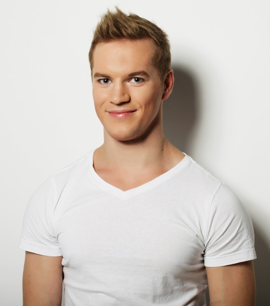 Handsome man in blank white shirt, happy face