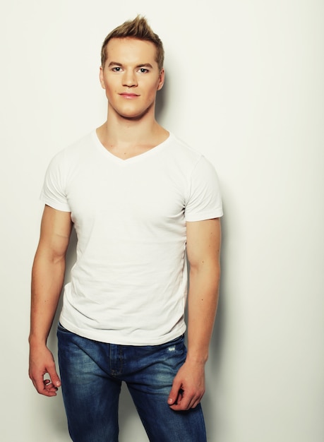 Handsome man in blank white shirt, happy face