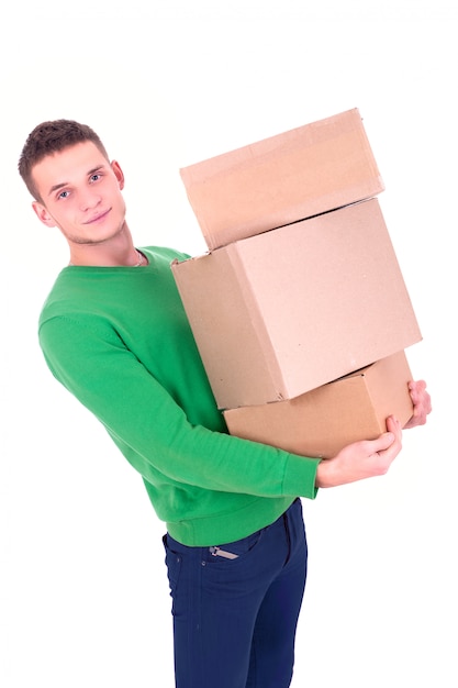 Handsome man carrying boxes