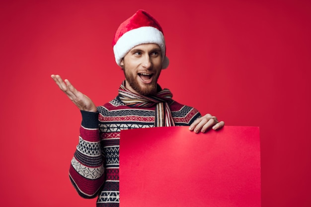 Photo handsome man in a christmas red mockup poster isolated background high quality photo