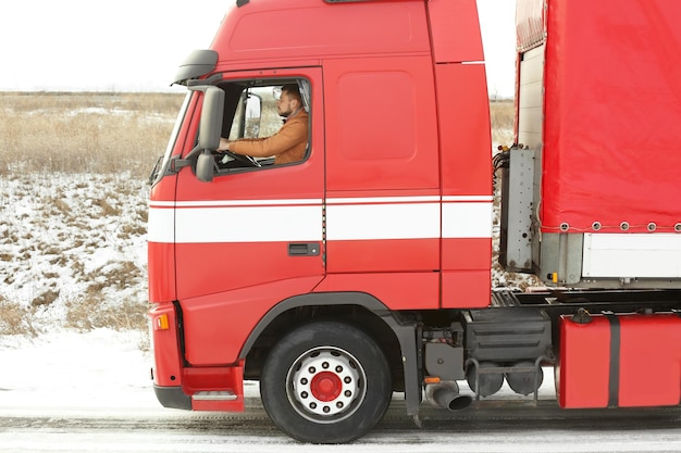 Handsome man driving big modern truck