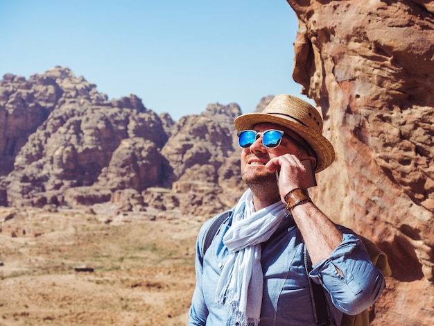 Handsome man, exploring the sights of of Petra