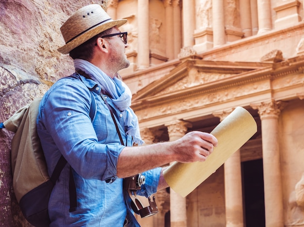 Handsome man, exploring the sights of of Petra