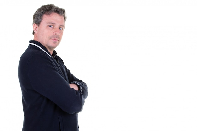 Handsome man in front of white wall  with arms crossed front of empty blank copy space