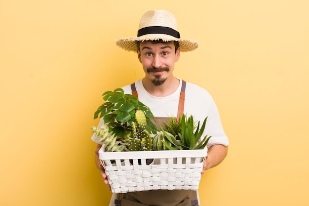 Handsome man gardering with plants